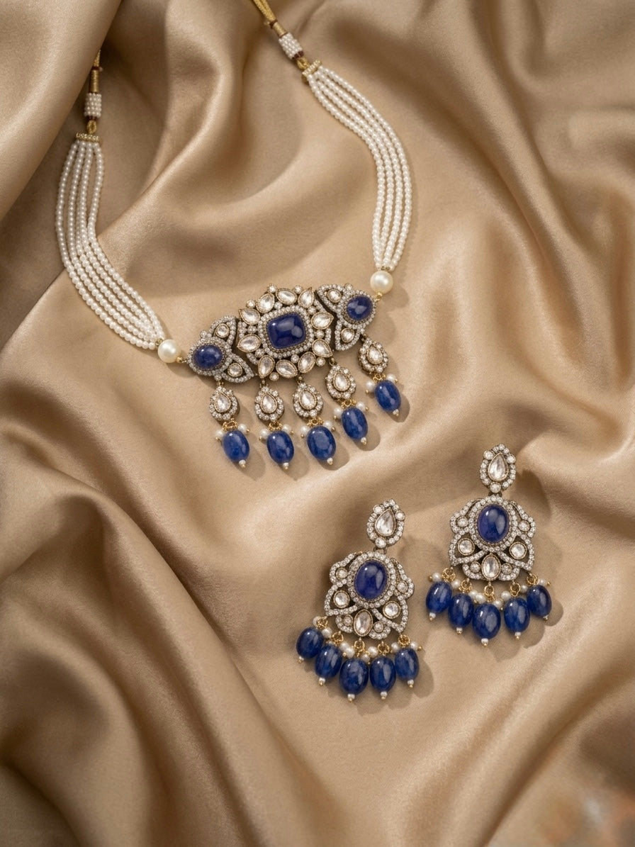 Jewelry set with necklace and earrings on beige fabric