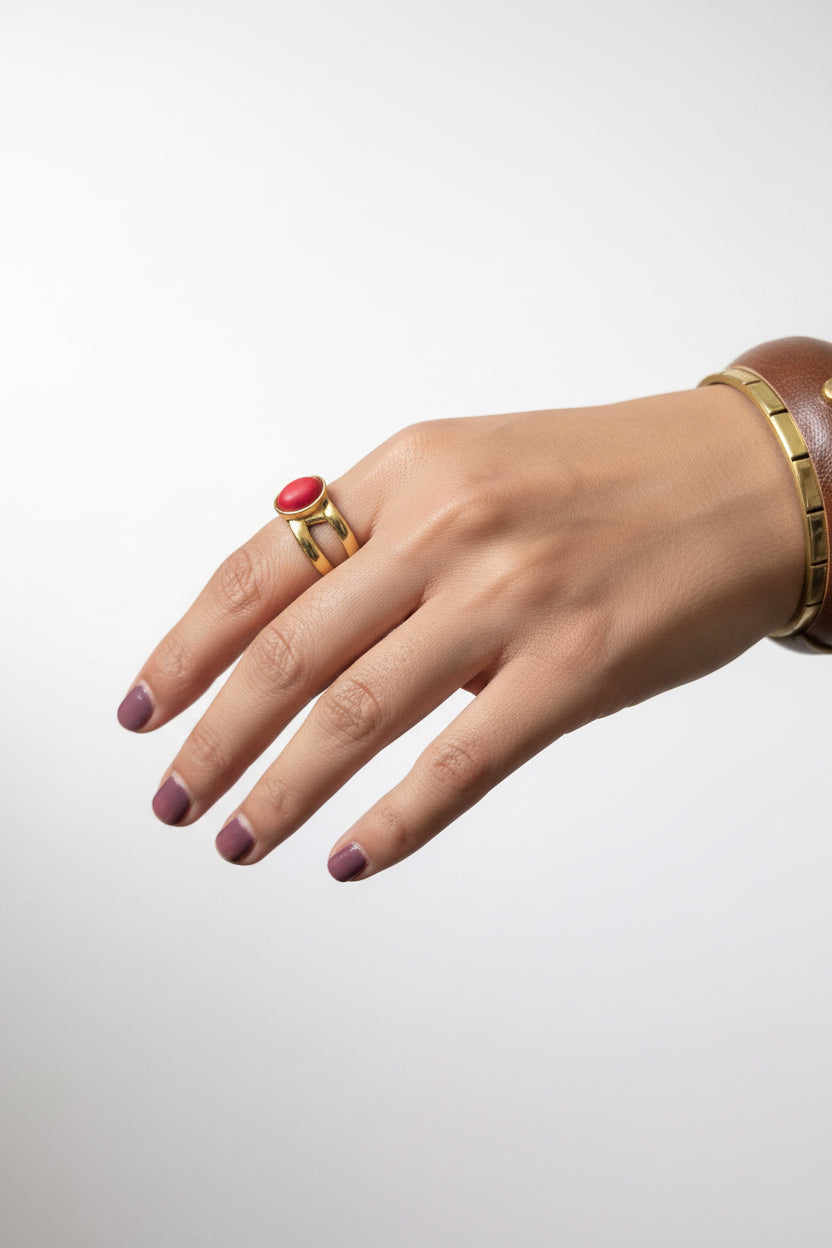 Gold double band oval red coral cabochon ring on woman's hand, bold red gemstone statement jewelry