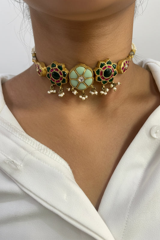 Close-up of a person wearing a decorative bracelet on a white background