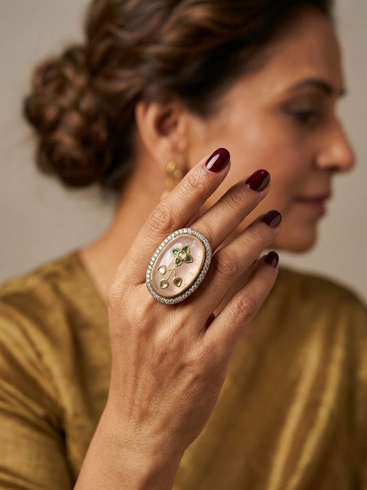 Rosé Garden Oval Ring featuring mother of pearl, floral kundan motif, green stone detailing and crystal border in a bold statement cocktail ring design