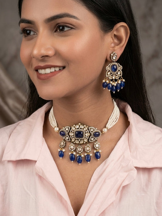 Woman wearing a traditional necklace and earrings with blue stones